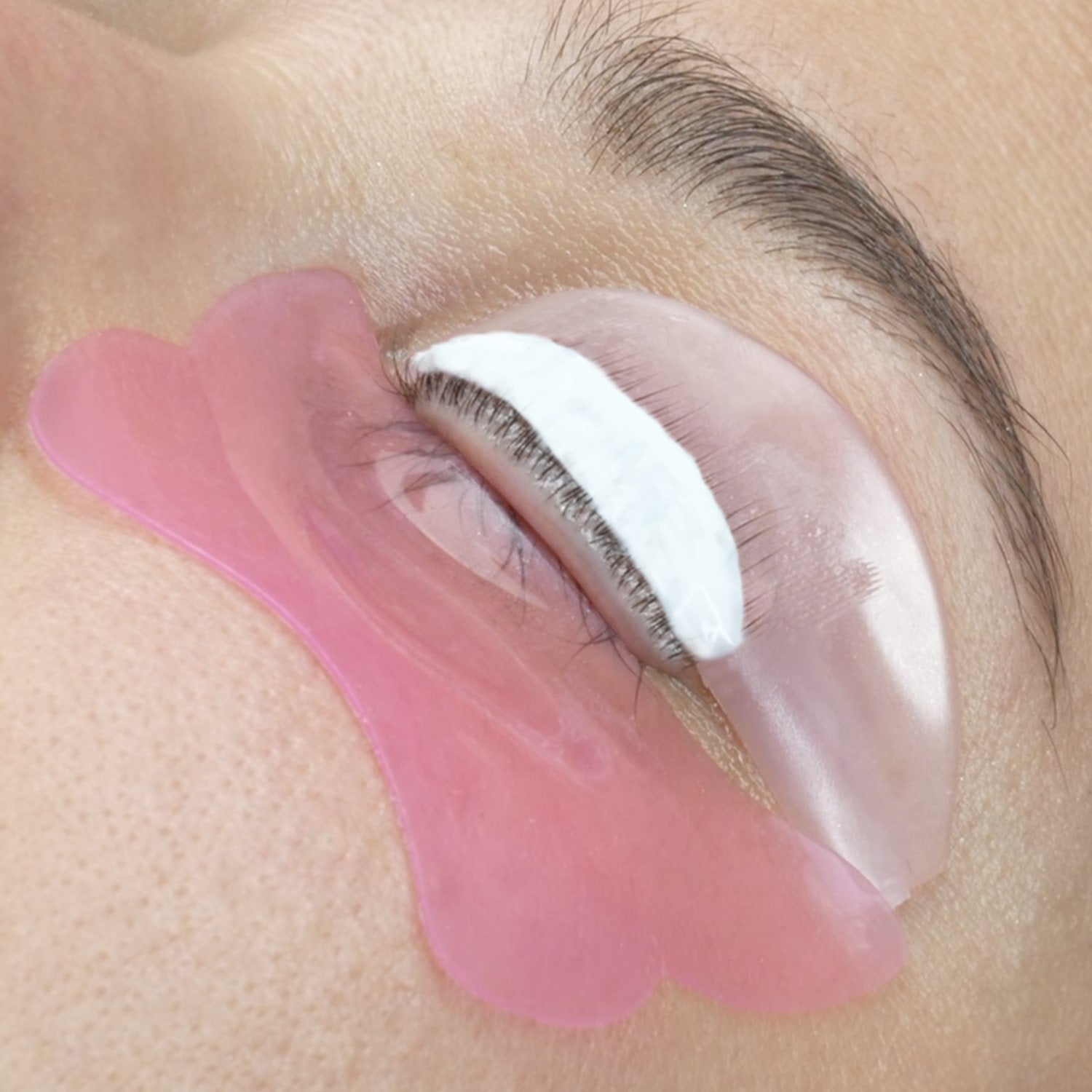 a flat pad applied to one eye during a korean lash lifting